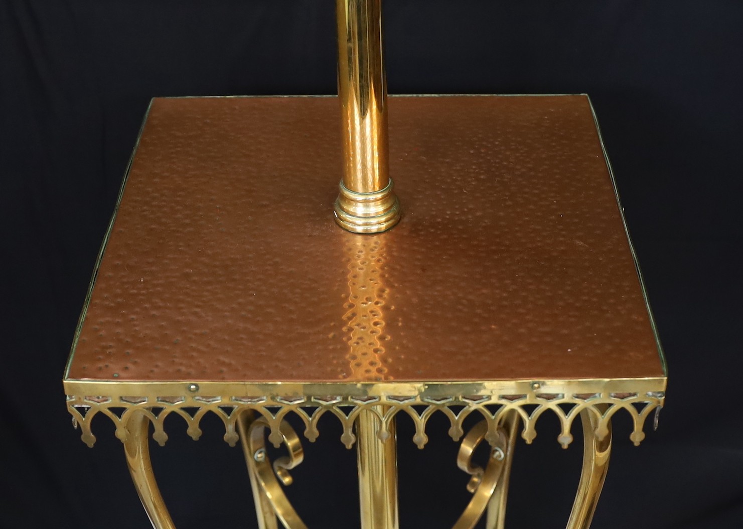 An Edwardian brass and copper telescopic oil lamp standard with scrolling underframe and etched glass globe, height 155cm. width 35cm